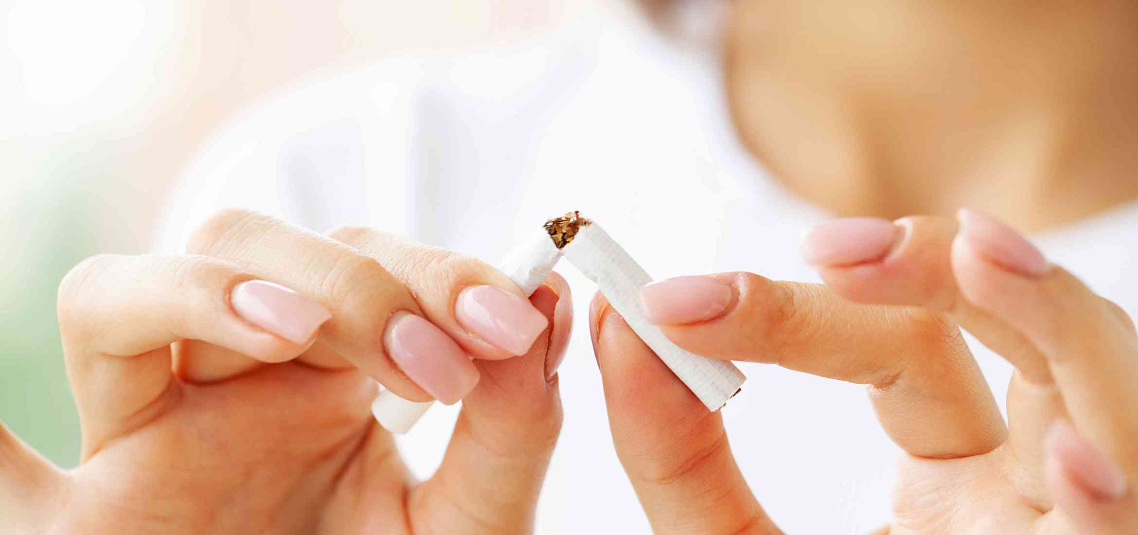 stop-smoking-close-up-woman-holding-broken-cigarette####.jpg